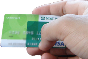 A debt card (or check card) for withdrawing money from checking account