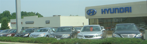 A car dealership carrying auto brands such as Audi, Hyundai, and others.